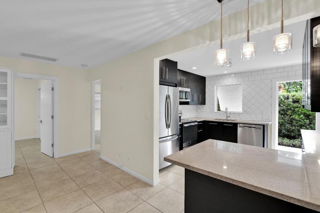 Photo of 320 NE 1st Avenue, Delray Beach, FL 33444 (MLS # R11082991)