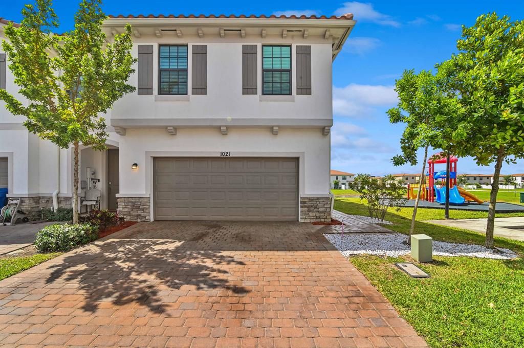 Photo of 1021 Kapok Lane, Riviera Beach, FL 33410 (MLS # R10878334)