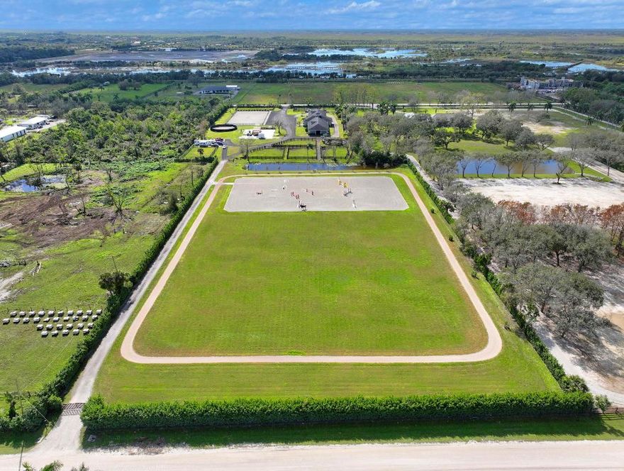 This 10 acre equestrian facility has frontage on both Norris Rd. & Deer Path Lane in Rustic Ranches Estates.. Built in 2018, the 24 stall center aisle CBS barn was designed by a true equestrian for optimal functionality and workflow. ADJACENT PROPERTY WITH HOUSE ALSO AVAILABLE! There are 4 blocks of 6 stalls, each with its own tack room. Each half of the barn has its own laundry room, feed room/storage and is equipped with ample grooming stations and wash stalls. The 250'x150' all weather arena by Gould is complimented by a large (280'x280') grass derby field and 1/4 mile exercise track. There is a second arena 100'x200' (that can be covered), 10 paddocks, a 4 horse walker and a round pen. There is a tent pad in place with water, electricity and 2 wash stalls for ten 10 additional stalls. 24 stall barn
4 tack rooms
2 laundry rooms
2 feed rooms
4 interior grooming stalls 
4 exterior but covered wash stalls
2 riding arenas (w/ full drainage and irrigation)(250'x150')(100'x200')
Walker (4 horse) (MK Walker)
Grass riding field ~2.2 acres (~280'x280')
Exercise Track ~ 1/4 mile around
10 paddocks
10 acres unified into one parcel
2 Rv hookups
2 septics for wash stalls
1 septic for future construction
Property is on city water
Irrigation is from a well and pond
