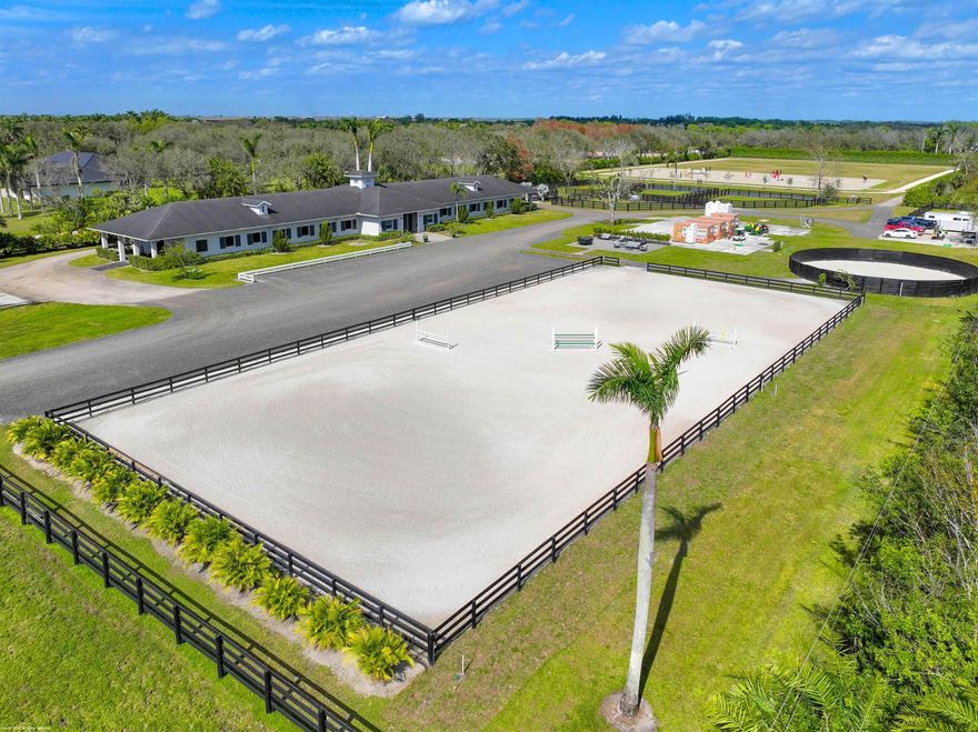 This 10 acre equestrian facility has frontage on both Norris Rd. & Deer Path Lane in Rustic Ranches Estates.. Built in 2018, the 24 stall center aisle CBS barn was designed by a true equestrian for optimal functionality and workflow. ADJACENT PROPERTY WITH HOUSE ALSO AVAILABLE! There are 4 blocks of 6 stalls, each with its own tack room. Each half of the barn has its own laundry room, feed room/storage and is equipped with ample grooming stations and wash stalls. The 250'x150' all weather arena by Gould is complimented by a large (280'x280') grass derby field and 1/4 mile exercise track. There is a second arena 100'x200' (that can be covered), 10 paddocks, a 4 horse walker and a round pen. There is a tent pad in place with water, electricity and 2 wash stalls for ten 10 additional stalls.