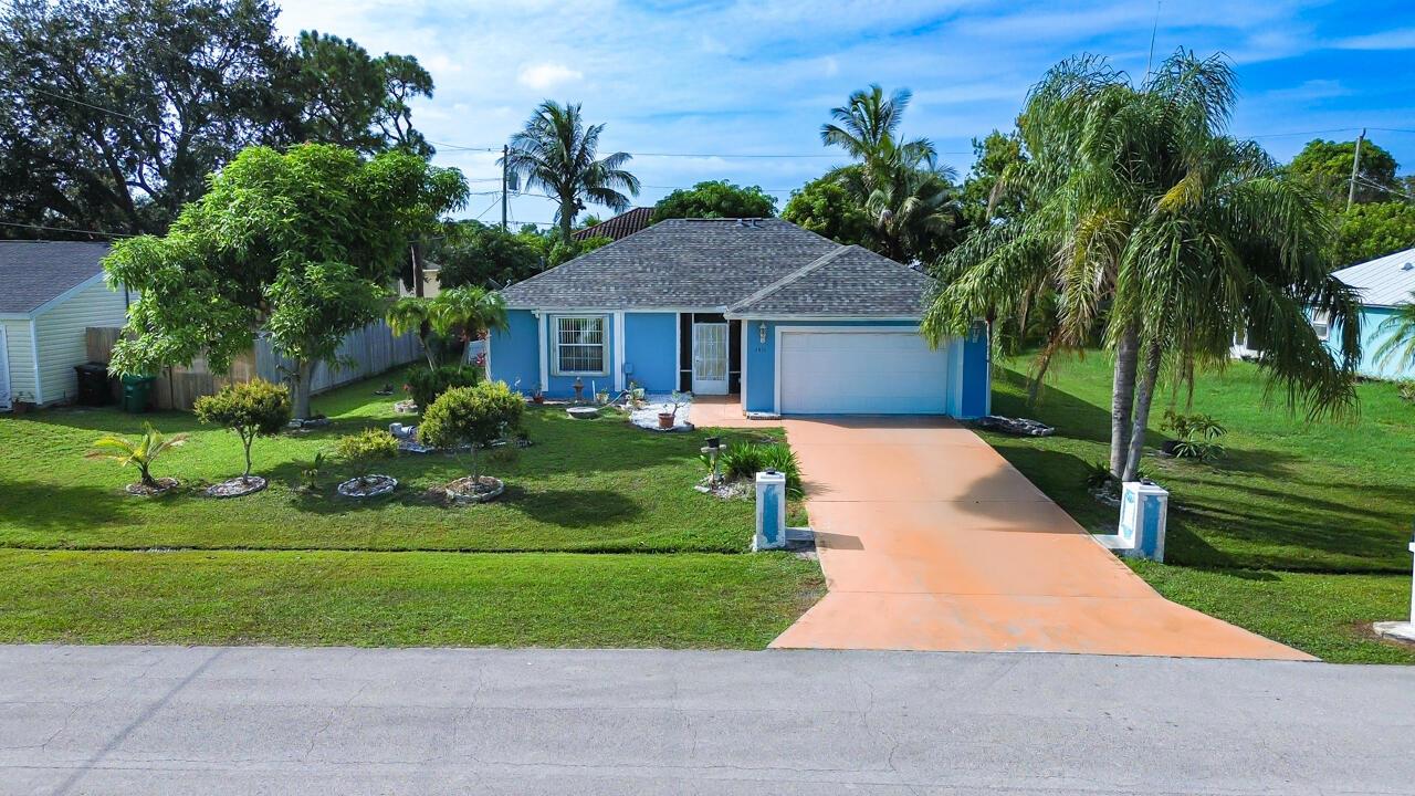 Welcome Home to this 3 bedroom 2 bath home in Port St Lucie! Featuring split bedrooms and Walk In Closets in all 3 bedrooms! The interior has been freshly painted. The kitchen also has a huge pantry with ample storage space. Enclosed 400+ ft Florida room gives you the perfect entertaining area! There is a complete set of Accordion shutters to protect from hurricanes and save you money on insurance. Mango trees, Banana trees along with Avocado and Cherry trees on site! The roof was replaced in 2022 along with the AC in 2019.