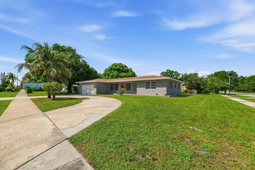 Photo of 207 BAYBERRY Drive, Lake Park, FL 33403 (MLS # B26081704)
