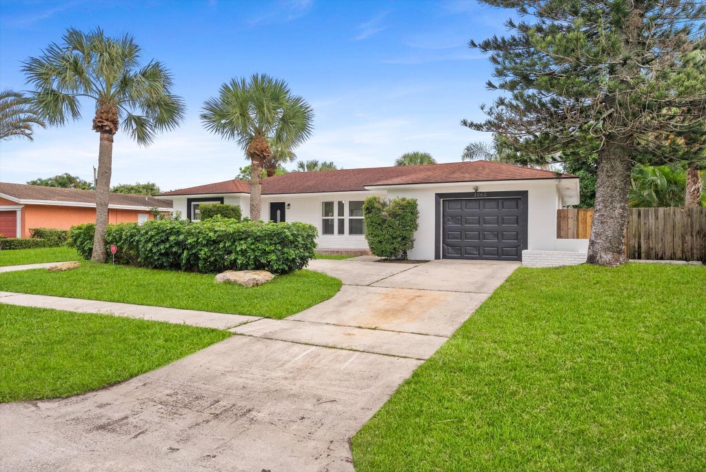 Photo of 1660 40TH Street, West Palm Beach, FL 33407 (MLS # B26085128)