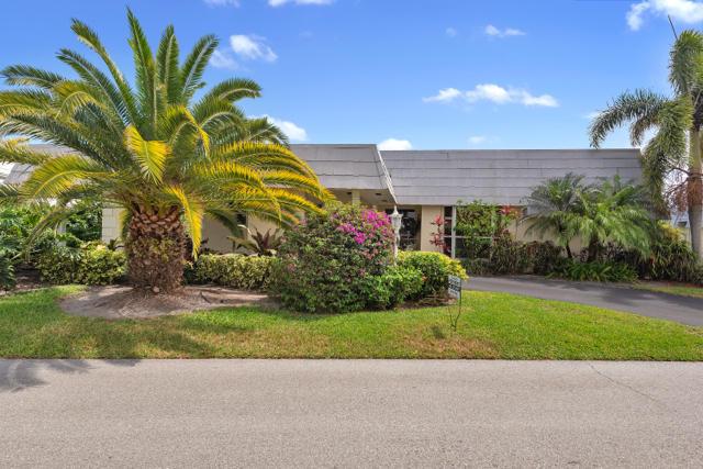 Single family lakefront villa in desirable French Royale Villas located in Atlantis, FL. Single story, contemporary style with amazing views of the lake and golf course. Close to I-95, shopping, fine dining and JFK hospital. Community offers amenities such as pool, tennis, pickleball, golf and so much more. This home has 3 bedrooms, 2 bath, an open concept floor plan with plenty of windows that allows natural lighting through-out the home. French doors leading to the outdoor space from the family room make this home great for entertaining. Master bedroom is nice size with 2 walk-in closets. Master bathroom has dual sinks with marble countertops and beautiful cabinetry. Kitchen has granite countertops, solid wood cabinetry that has ample storage to meet your needs and GE Profile stainless