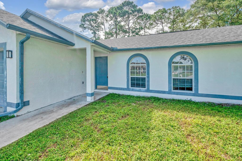 Photo of 1800 SW Glenco Street, Port Saint Lucie, FL 34953 (MLS # R11020013)