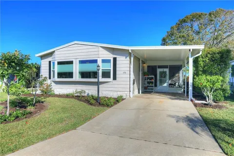 496 Dolphin Circle, Barefoot Bay, FL MLS: R11056624