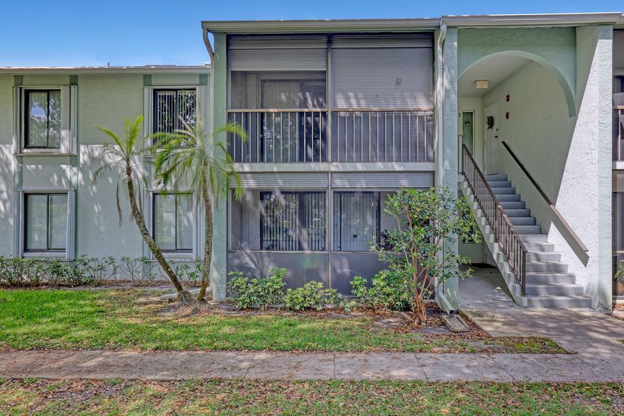 Welcome to your waterview home in Palm Club West! This spacious condo offers 1,462 sq ft of living space, featuring beautiful wood flooring throughout and an updated kitchen with granite countertops and white cabinets. The bathroom is updated and modern, perfect for your needs.  You'll find ample bedrooms where you can relax and unwind, along with a separate room for the washer and dryer for added convenience. Step outside to your private balcony, an ideal spot to soak up the Florida sunshine. With a newer AC unit, you'll stay comfortable all year round.  Conveniently located near I-95 and the Turnpike, commuting is easy, and shops, restaurants, and recreational activities are just a short drive away. This condo is a fantastic place to call home!