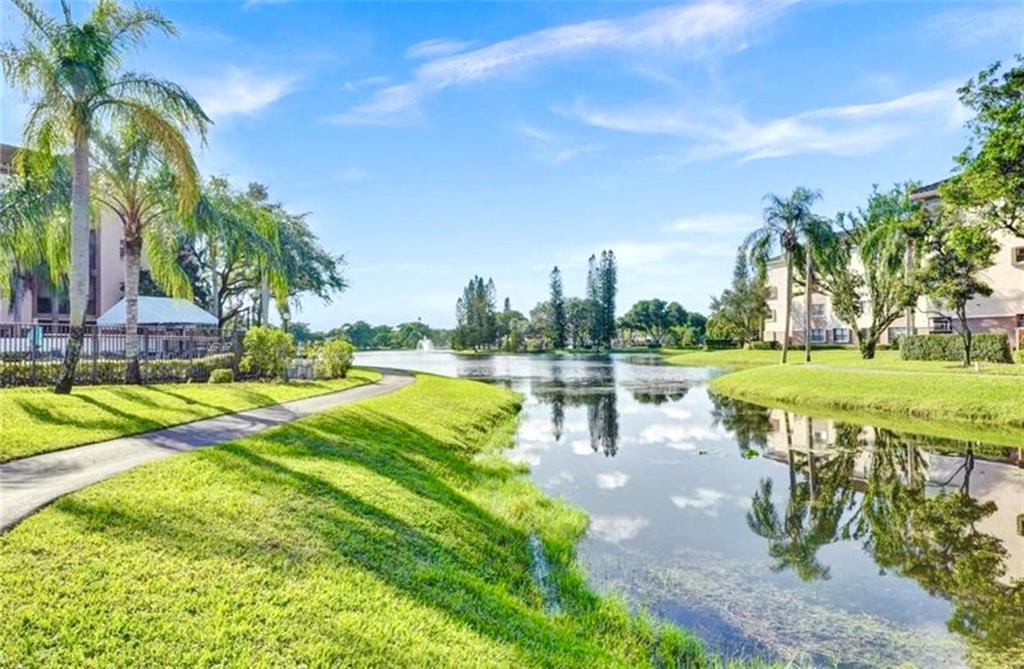 Wonderful Coconut Creek Lifestyle at Bayport Village in "The Township". ALL AGES WELCOME !!
FIRST FLOOR with Lakefront views from all main living areas. 2/2 Condo, 1298 SF of living space. Floor plan includes Master Bedroom featuring a Walk-In closet as well as an additional, modern design Armoire.
Upgrades: "RainSoft" Water Conditioning System for whole Unit, bedrooms Laminate Flooring, all other rooms Tile, Accordion Shutters, Crown Moulding, New AC System (2018), Kitchen (2017): Granite Counter Tops & Cabinets. Lastly a 52 Gal. Water Heater goes with an amazing "Jacuzzi" Walk-In Whirlpool, Soaking Tub.
Amenities:Theater, Movies, Live Shows, Ballroom, Olympic Pool, Hot Tub, Sauna, Athletic Club, Tennis, Shuffle Board, Basketball, Pickle Ball Courts. Trendy PROMENADE 5 minutes away