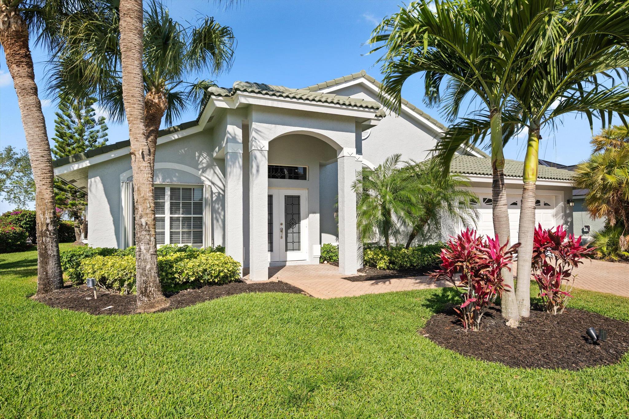 Private secluded gated community! Home is move-in ready. Property boasts 4 Bedrooms, 2 updated baths, as well as an updated kitchen with granite countertops and newer SS appliances. Accordion shutters for easy storm prep. Enjoy magnificent sunset views overlooking the Wanderers Golf Course. Dine alfresco in the screened-in covered patio. Wonderful schools. Less than four miles to the Horse Show. Close to all equestrian venues, shops and restaurants. A must see!