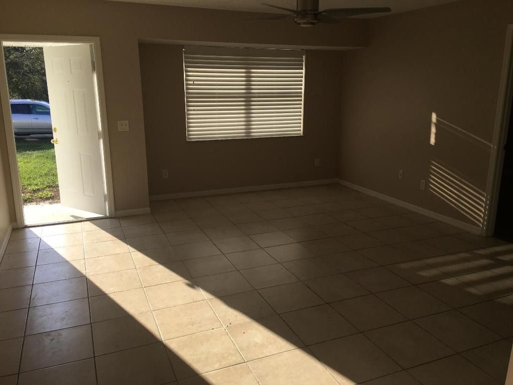 Photo of 3873 SW Daisy Street, Port Saint Lucie, FL 34953 (MLS # R10950118)