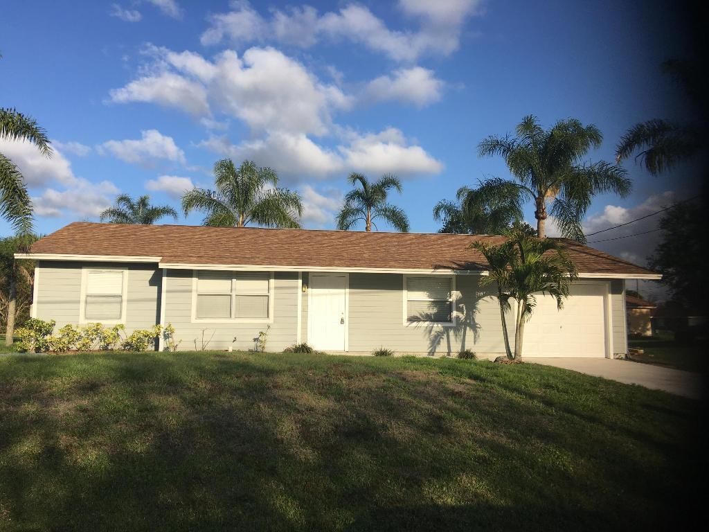 Photo of 3873 SW Daisy Street, Port Saint Lucie, FL 34953 (MLS # R10950118)