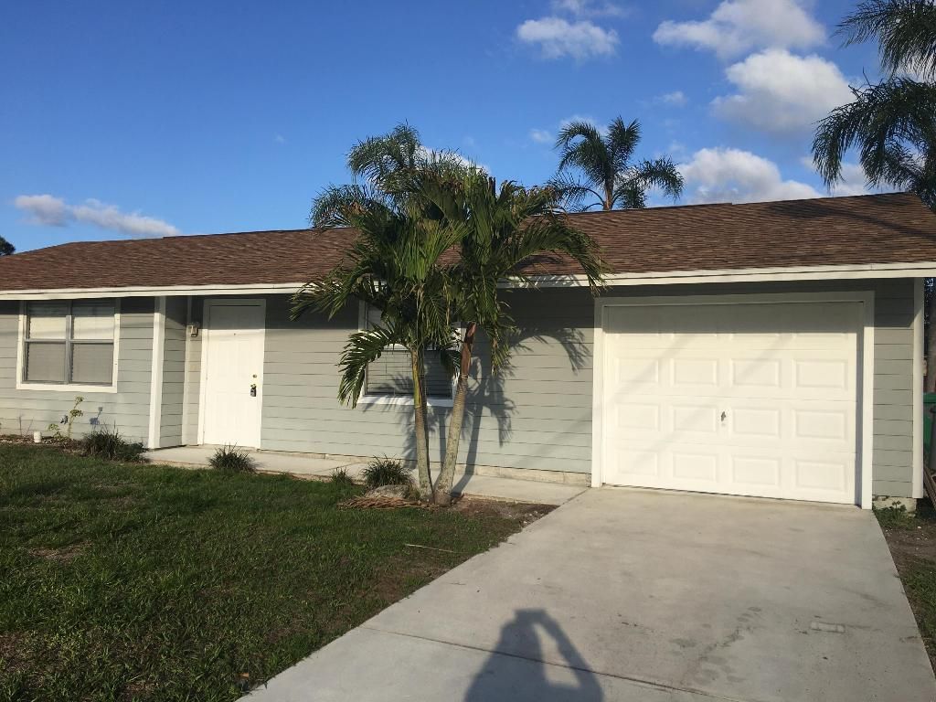 Photo of 3873 SW Daisy Street, Port Saint Lucie, FL 34953 (MLS # R10950118)