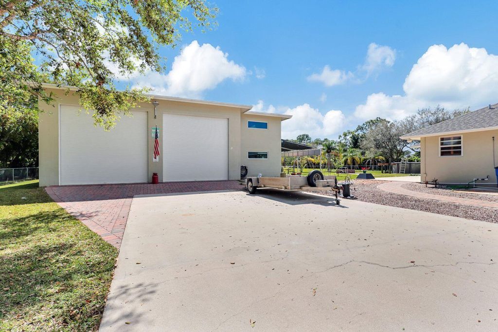 Photo of 14918 Tangleo Boulevard, West Palm Beach, FL 33412 (MLS # R10964002)