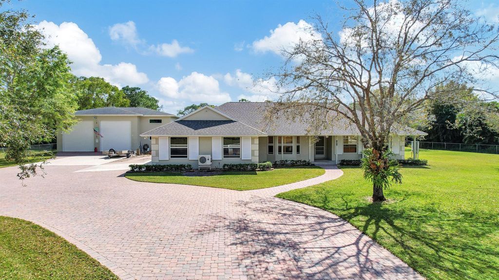 Photo of 14918 Tangleo Boulevard, West Palm Beach, FL 33412 (MLS # R10964002)