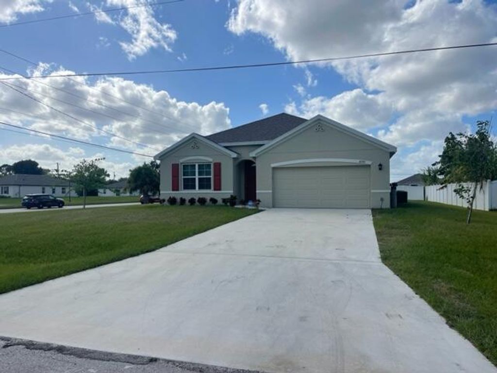 Photo of 4598 SW Tabor Street, Port Saint Lucie, FL 34953 (MLS # R10935947)