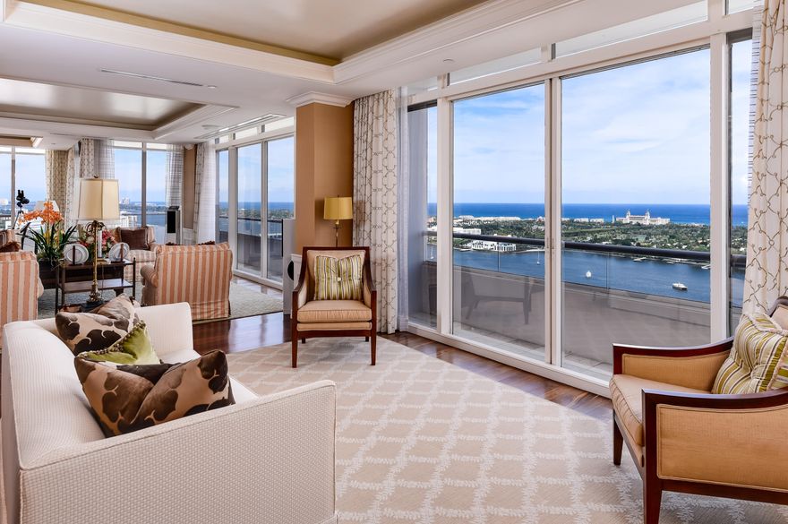 Exquisite fully renovated double Penthouse in Trump Plaza with sweeping views of the Ocean, Intracoastal Waterway, and the Island of Palm Beach. Ten foot ceilings. Three bedrooms, three and a half bathrooms. Expansive living room, eat-in kitchen, dining room and den. Spacious 4,000 +/- open floor plan with exceptional waterviews. Walk-in closets. East, North and West exposures.  Outdoor balconies offer additional living space and waterviews. Full service, luxury building with 24 hour security, valet parking, concierge, billiard room, two swimming pools, fitness room, and tennis court. Pet friendly building. Easy distance to all that the area has to offer: shops, restaurants, CityPlace, ocean beaches and Palm Beach nightlife. Call today to preview this move-in ready residence.