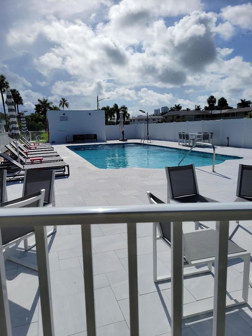 COME AND ENJOY OUR COMING SEASON AT THIS BEAUTIFULLY COMPLETED NEW POOL AREA. FLORIDA AT IT'S FINEST!! JUST REDUCED!! FIRM! OWNER RELOCATING  HAVE YOUR OWN WINTER ESCAPE. FIRST FLOOR UNIT WITH IMPACT WINDOWS AND DOORS, COMPLETELY REMODELED BATH SIMPLY GORGEOUS WITH WALK IN SHOWER. KITCHEN IS FULLY EQUIPPED. PLENTY OF CLOSET SPACE ALSO ADDED CLOSETS CAN STAY. EXCUSIVE BLACKOUT SHADES INSTALLED. NEXT DOOR TO LAUNDRY ROOM AND RIGHT ACROSS FROM THE POOL.  IT REALLY GIVES THE EFFECT OF A SOUTH BEACH SPA! LOCATED EAST OF US1 AND CLOSE TO THE MARDIGRAS CASINO,GULFSTREAM RACETRACK AND CASINO, LOTS OF SHOPPING AND NEW RESTAURANTS, BUS STOP OUTSIDE YOUR DOOR. BEACHES JUST MINUTES AWAY. 55+ .COMMUNITY NO LEASE. SPEND YOUR WINTER IN THIS BEAUTIFUL ENVIRONMENT!!!