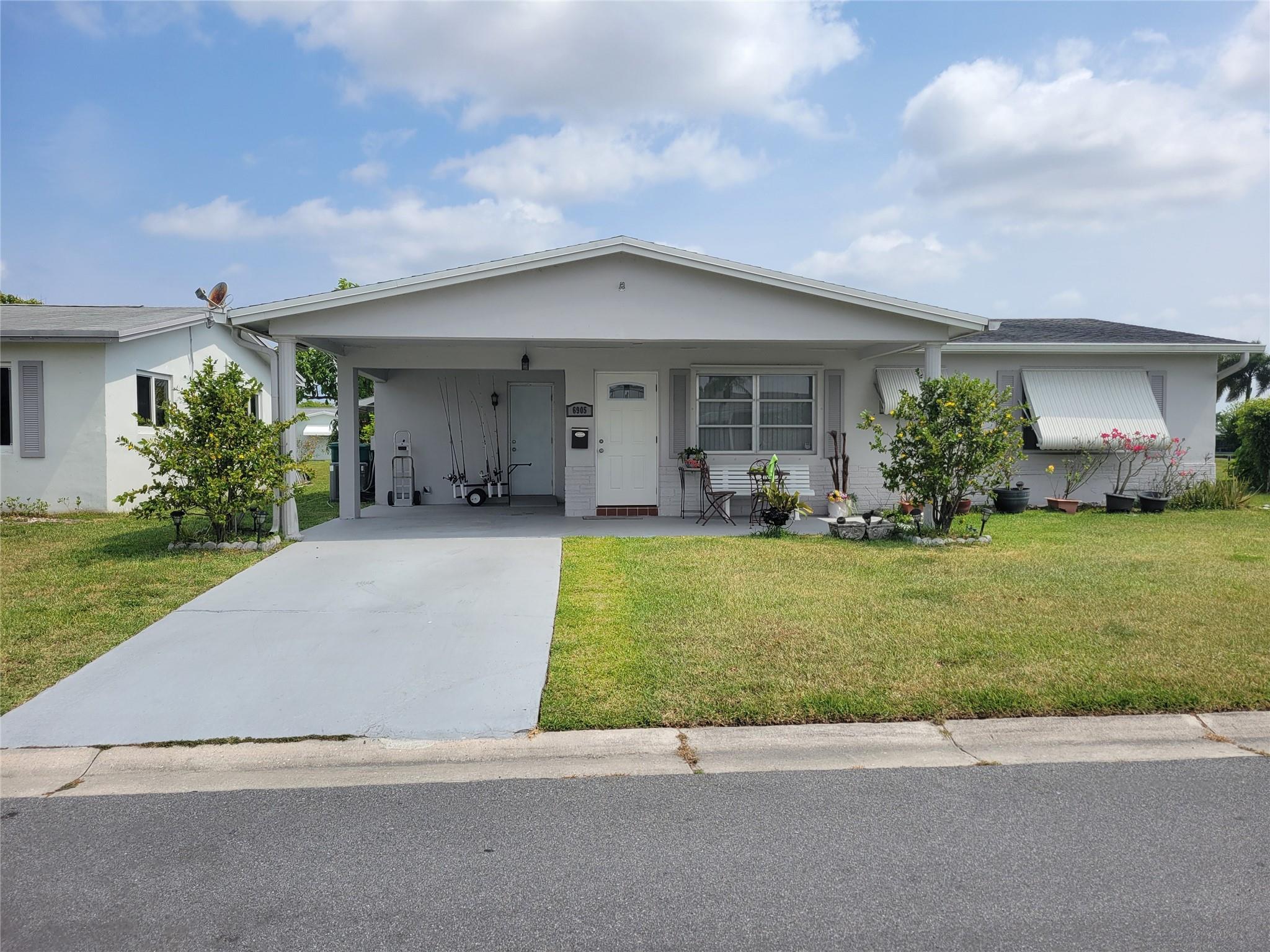 PRICE TO SELL 2/2 home with canal view, located on 55+ community, low HOA $80/month includes lawn care one a week, painting the house exterior every 5 years, clubhouse with swimming pool, kitchen and bathroom has been updated, walking closet in both bedroom, large patio could be third bedroom. Easy access to I95 and turnpike, shopping and restaurant near by, friendly neighborhood, it a good place to live.