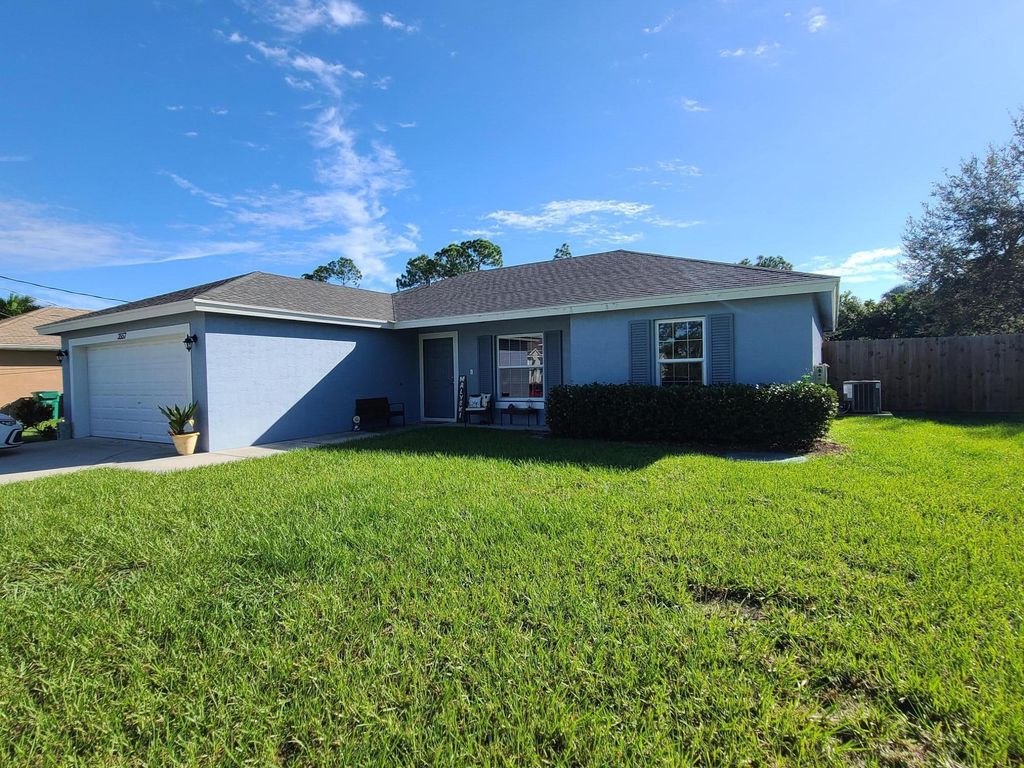 Photo of 3557 SW Kromrey Street, Port Saint Lucie, FL 34953 (MLS # R10948759)