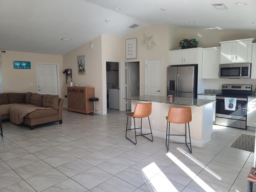 Photo of 3557 SW Kromrey Street, Port Saint Lucie, FL 34953 (MLS # R10948759)