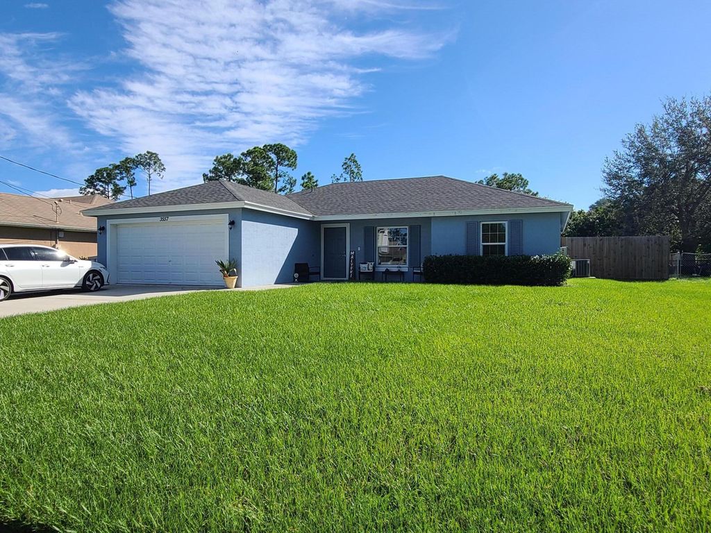 Photo of 3557 SW Kromrey Street, Port Saint Lucie, FL 34953 (MLS # R10948759)