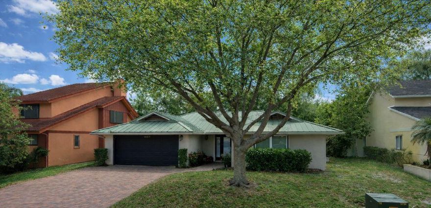 Located in the heart of Palm Beach Gardens with no HOA, this updated 3-bedroom, 2-bath, 2-car garage pool home offers over 1,600 A/C sq ft of comfortable living and exceptional outdoor space.  The private backyard is designed for both relaxation and recreation, featuring a saltwater pool with new Diamond Brite finish, a travertine pool deck, and a turfed yard with putting green. A vinyl privacy fence (2022) enhances both security and low-maintenance living.  Interior upgrades include a remodeled kitchen and bathrooms (2023), along with major system improvements for peace of mind: A/C (2023), water heater (2025), and a durable metal roof. The home is equipped with impact windows and accordion shutters for majority of the home.  Additional features include LeafFilter gutter system, a newly installed 220V EV charging outlet, and a Sentricon termite protection system with ongoing service through Beaches Environmental.  California Closet systems in primary & 2nd bedroom.  This property offers a rare combination of location, upgrades, and freedom from HOA restrictions—ideal for full-time residents & seasonal owners.