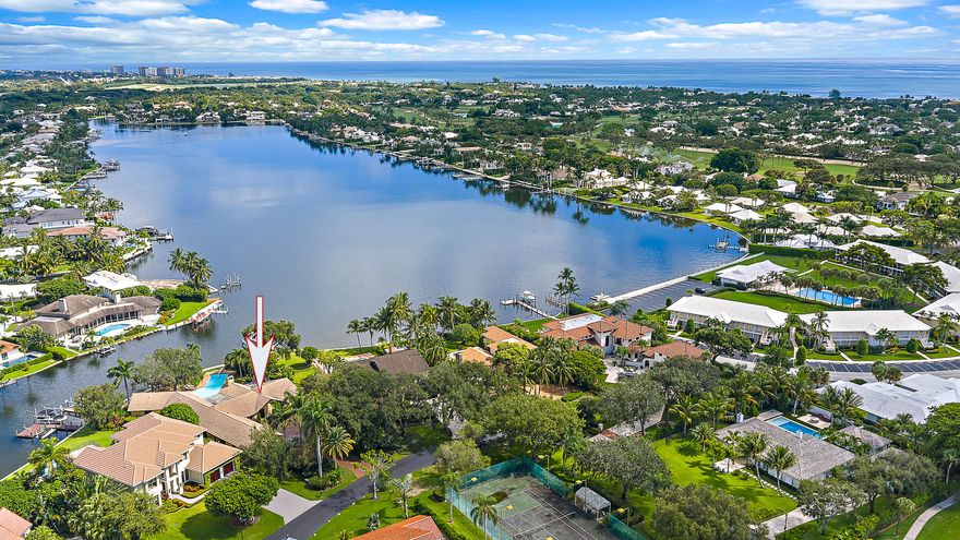 Welcome to 1938 Portage Landing North! Located in a gated community with low HOA fees, this one-story CBS residence sits on over a half-acre and offers more than 125 feet of wide water views and a newer seawall. The home features 4 bedrooms plus an office, a 4-car garage, a formal dining room, a spacious living room, a TV room, a whole-house generator, an oversized pool, an in-ground spa, and outdoor kitchen.  An attached secondary suite offers a gym, living area, and kitchenette which provides additional space and flexibility, all while showcasing expansive water views. With its oversized lot, wide water views, and endless potential to customize or build new, this property is a rare opportunity in North Palm Beach.