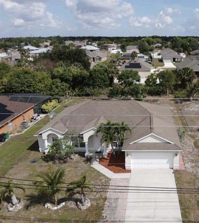 Photo of 933 SW Mcdevitt Avenue, Port Saint Lucie, FL 34953 (MLS # R10824033)