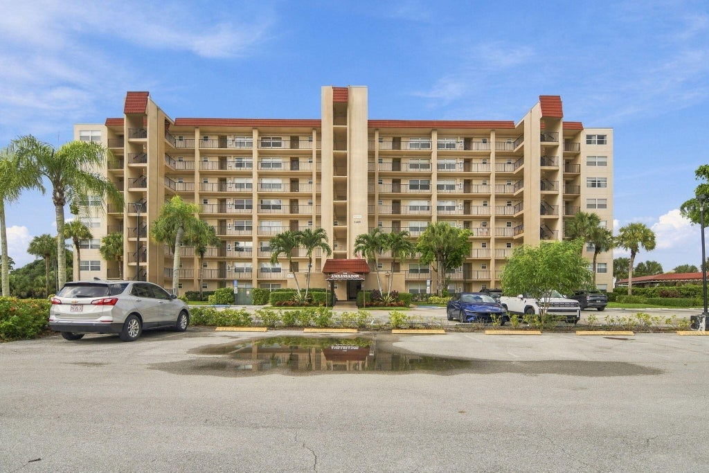 Photo of 3465 Via Poinciana #405, Lake Worth, FL 33467 (MLS # B26078412)