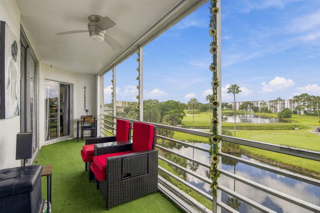 Photo of 3465 Via Poinciana #405, Lake Worth, FL 33467 (MLS # B26078412)