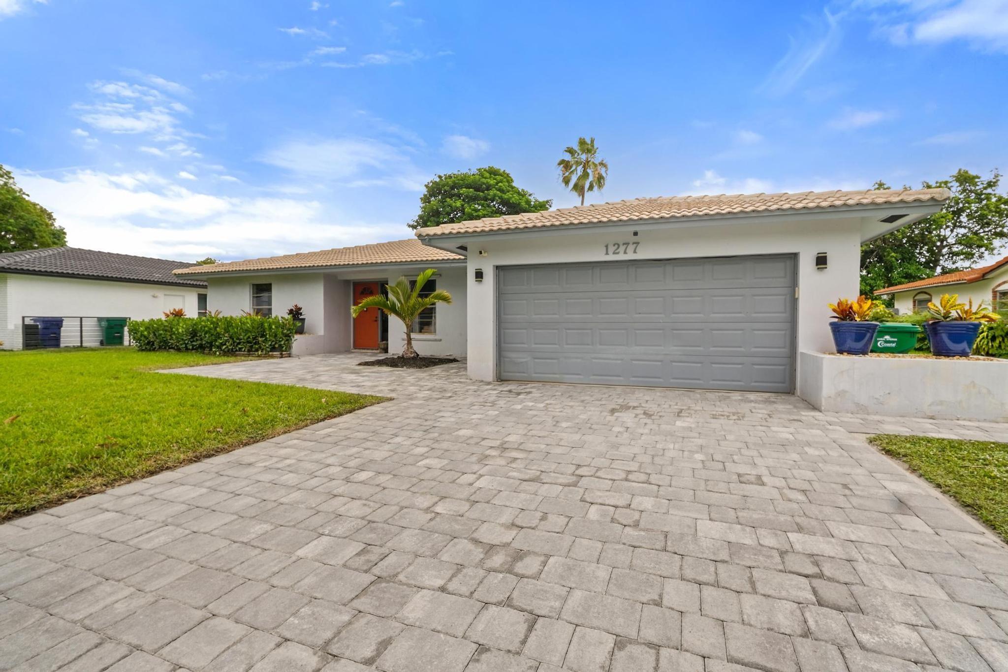 Beautiful very well-kept property in Ramblewood South of Coral Springs. Wonderfully sought after property with U-shaped open concept sits on almost 1/4 quarter of an acre. New rich mahogany wood floors throughout and same color laminate in master bedroom. Updated wide eat-in kitchen overlooking family room with granite countertops and new built-in cabinets for plenty of storage space. Appliances are new including the refrigerator, microwave, dishwasher, washer, dryer and water heater plus new AC unit. Updated electrical panel with copper feed. Separated sunken living room with built in wall mounted entertainment center. Fenced in, turf-covered backyard with beautifully manicured landscaping. Screened in pool and new pool pump. Garage door and side door are hurricane-rated.