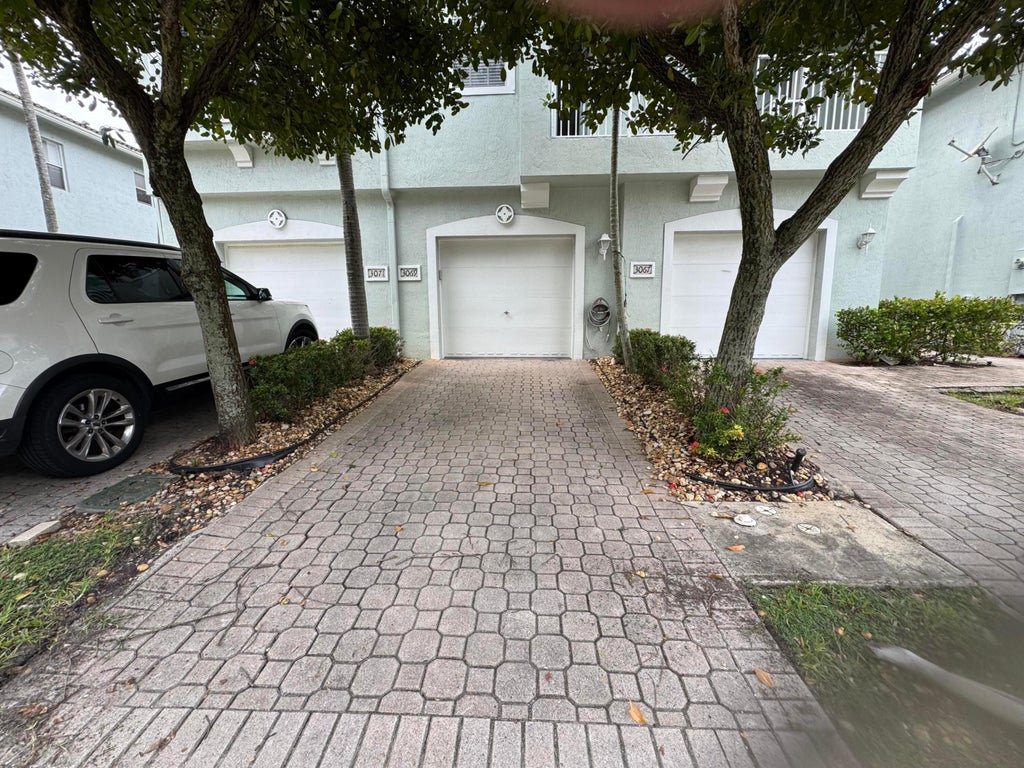 Photo of 3069 LAUREL RIDGE Circle, Riviera Beach, FL 33404 (MLS # B26079577)