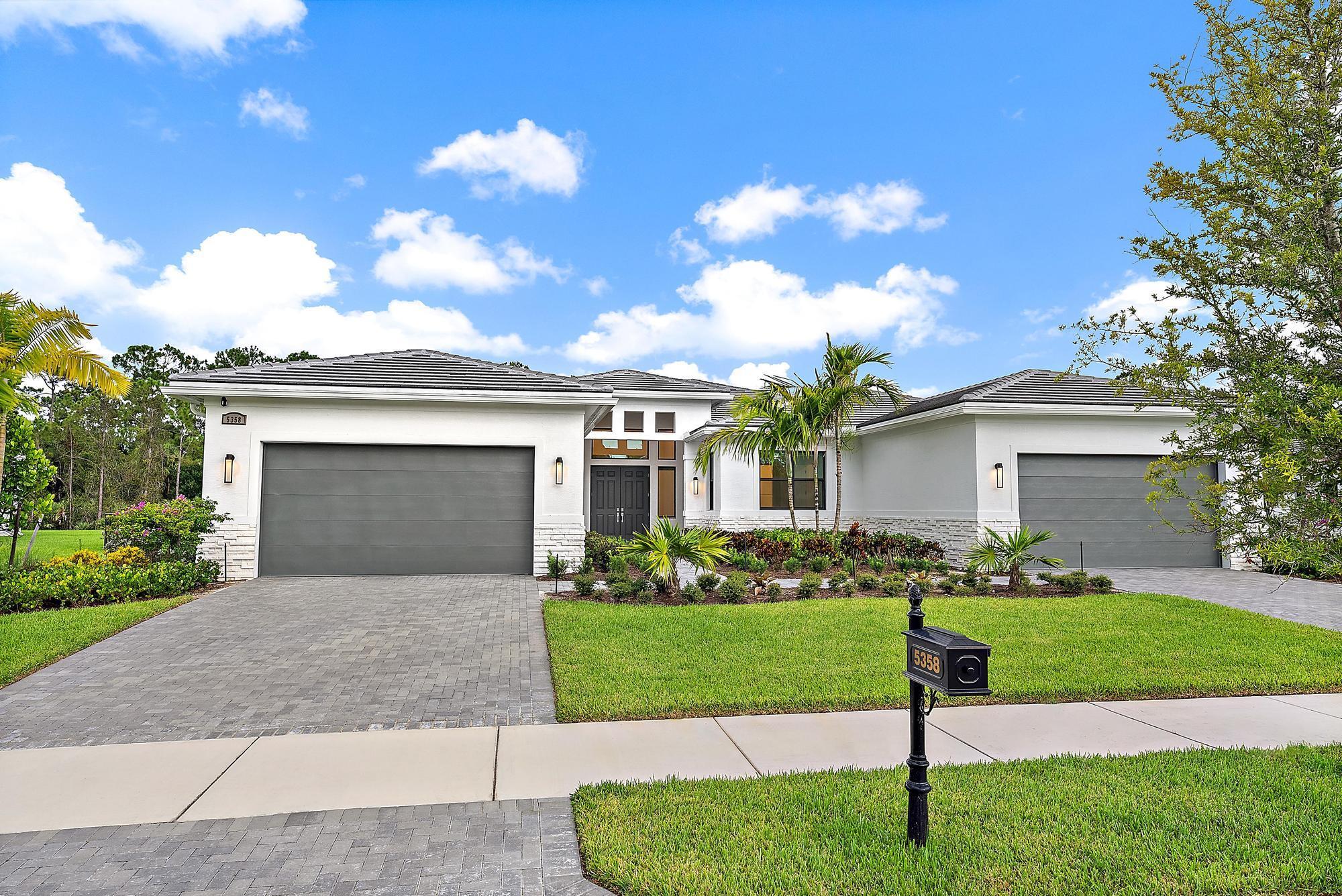 Exquisite 4 bedroom + club room, 4.5 bath CBS estate home in the prestigious gated community of Canopy Creek. Built in 2024, this 4,324 sq ft residence is the perfect blend of modern elegance and thoughtful upgrades, featuring soaring ceilings, a light-filled open floor plan, impact windows, and an extended lanai with a summer kitchen--ideal for both grand entertaining and relaxed Florida living.Step through the elegant double doors into a bright and spacious foyer, where serene preserve views immediately draw you in. The open-concept great room boasts abundant natural light and seamless flow into the club room, creating a versatile space for gatherings or quiet evenings. The gourmet chef's kitchen is the heart of the home, showcasing a large quartz
