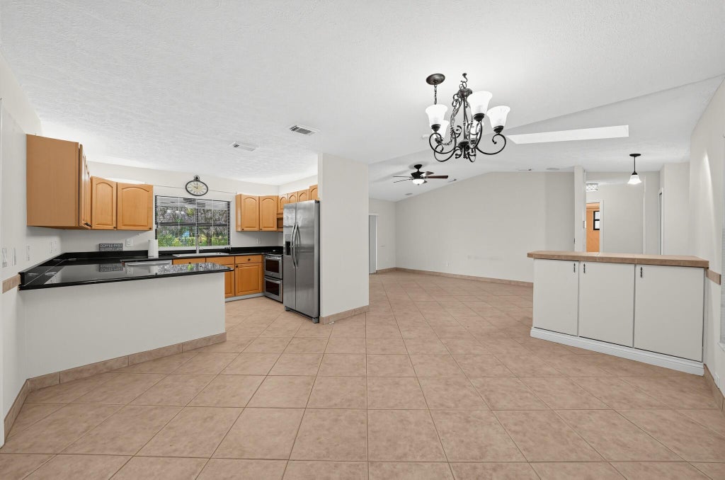 Photo of 3951 SW CHERIBON Street, Port Saint Lucie, FL 34953 (MLS # B26070313)