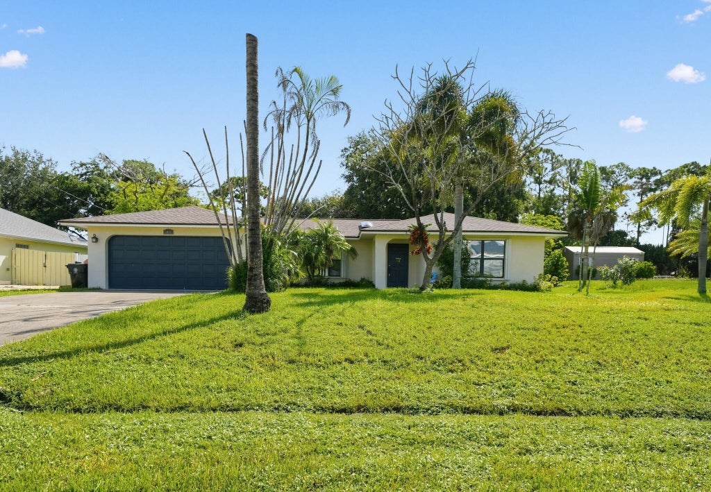 Photo of 3951 SW CHERIBON Street, Port Saint Lucie, FL 34953 (MLS # B26070313)