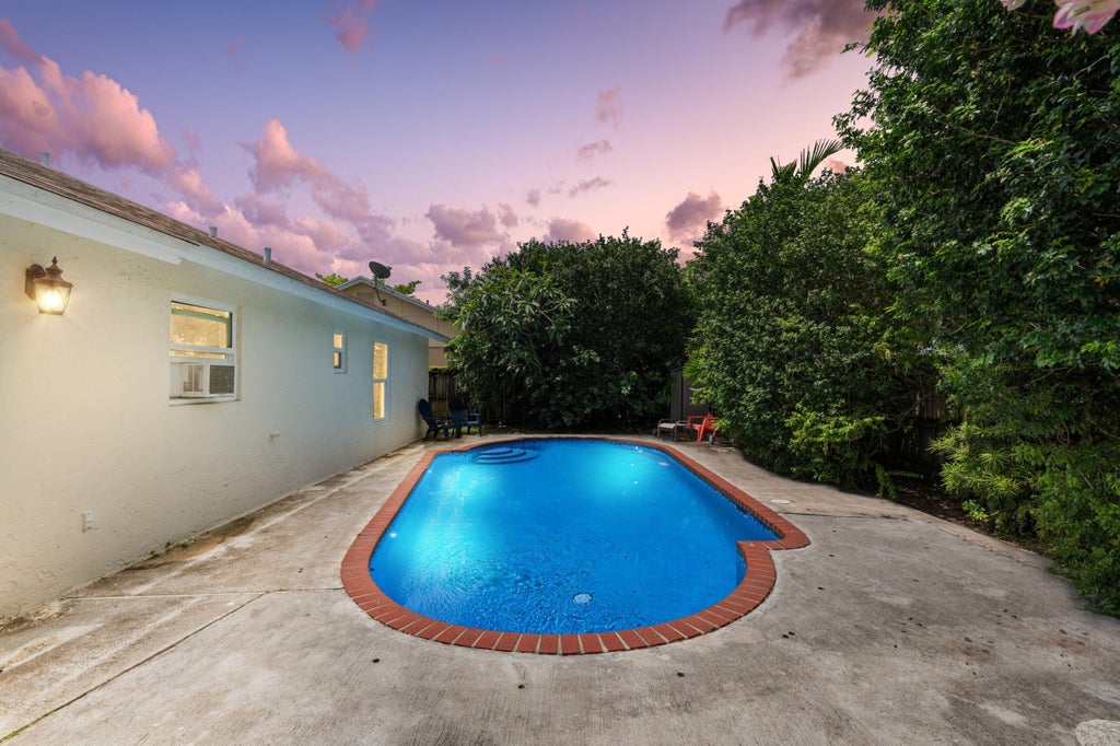 Photo of 14529 Sunset Pine Drive, Delray Beach, FL 33445 (MLS # R11100613)