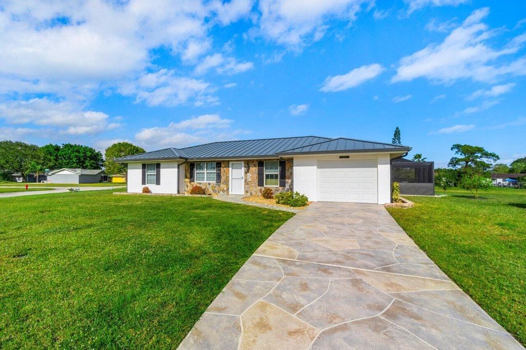 Photo of 1697 SE Lyngate Drive, Port Saint Lucie, FL 34952 (MLS # R11064819)