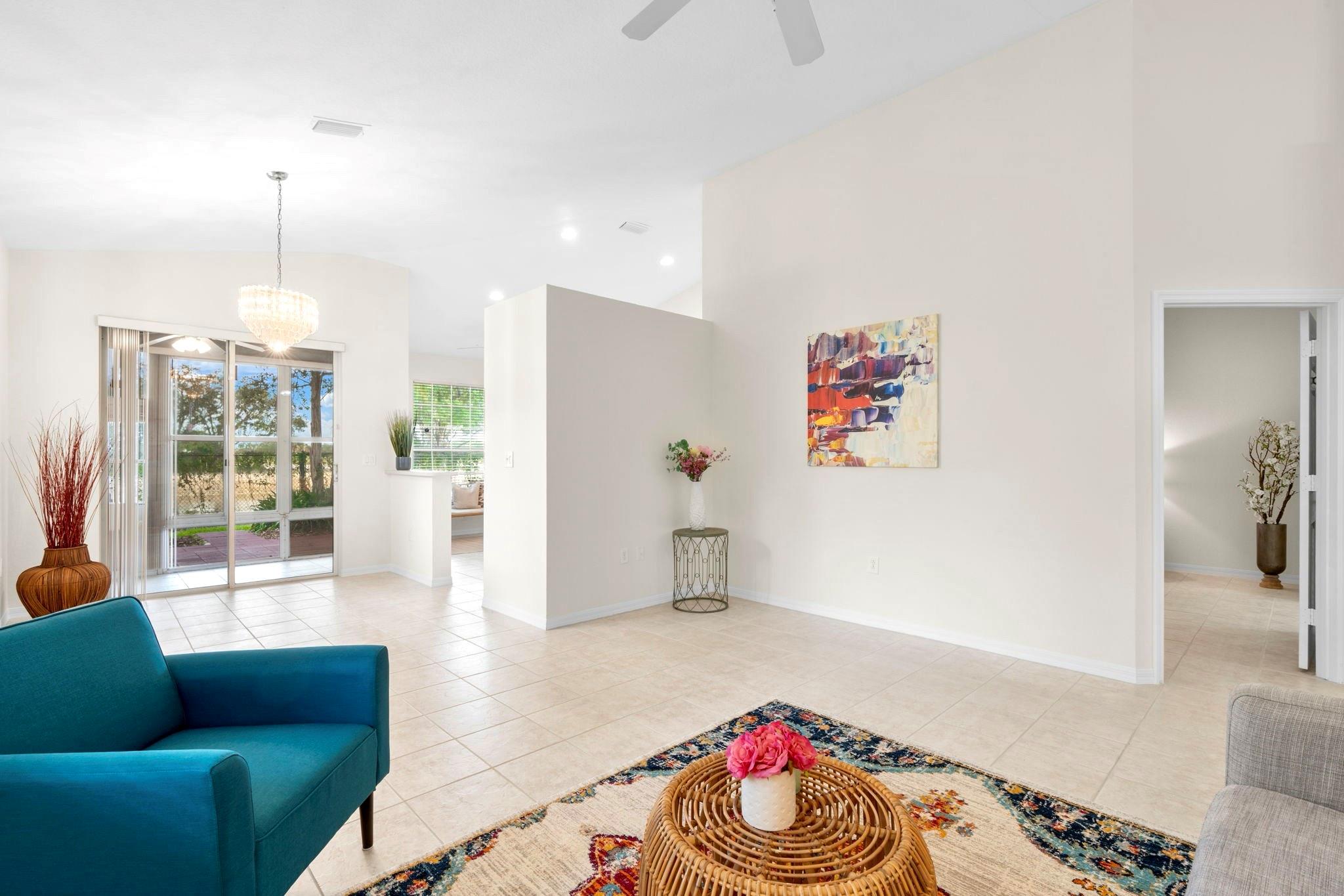Beautifully maintained 2BR/2BA corner unit in the desirable gated community of Regency Club. This light-filled unit features vaulted ceilings, a spacious split floor plan, and extra windows for added brightness and views of the outside. The oversized primary with 2 walk-in closets and a private screened sunroom w/ tranquil lake views. Enjoy a large back patio shaded by mature trees, perfect for relaxing outdoors. One-car garage and located just steps from the pool and clubhouse. Freshly painted and move-in ready, this unit also features a newer HVAC system (2021) and shutters for worry-free living. Low HOA covers lawn care, cable, 2 pools, spas, 2 clubhouses, gym, tennis & basketball courts. Conveniently located just off Oakland Park Blvd with easy access to shops, dining, and major roads.