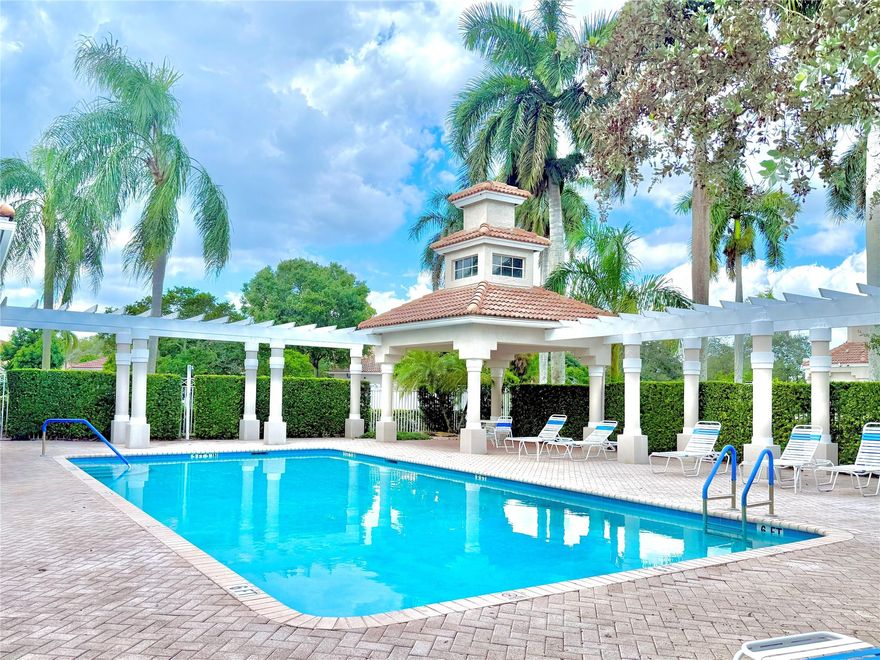 Beautifully maintained 2BR/2BA corner unit in the desirable gated community of Regency Club. This light-filled unit features vaulted ceilings, a spacious split floor plan, and extra windows for added brightness and views of the outside. The oversized primary with 2 walk-in closets and a private screened sunroom w/ tranquil lake views. Enjoy a large back patio shaded by mature trees, perfect for relaxing outdoors. One-car garage and located just steps from the pool and clubhouse. Freshly painted and move-in ready, this unit also features a newer HVAC system (2021) and shutters for worry-free living. Low HOA covers lawn care, cable, 2 pools, spas, 2 clubhouses, gym, tennis & basketball courts. Conveniently located just off Oakland Park Blvd with easy access to shops, dining, and major roads.