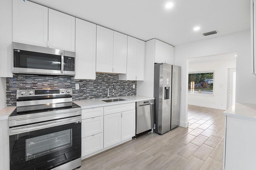 Photo of 370 S Golf Blvd, Pompano Beach, FL 33064 (MLS # F10532322)