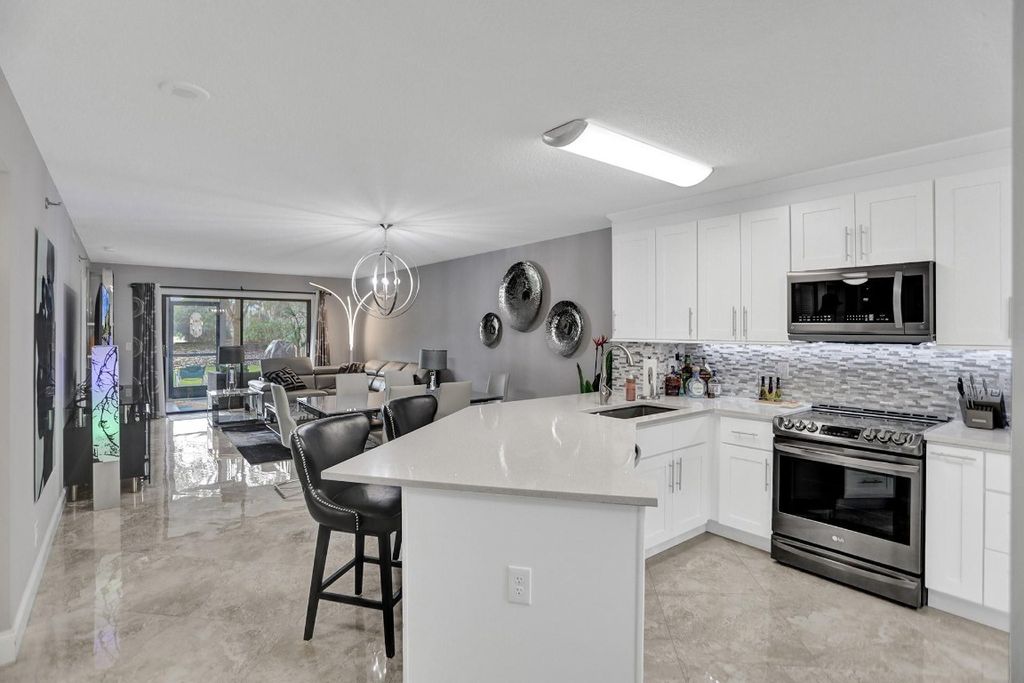 Photo of 2238 N Cypress Bend Drive #105, Pompano Beach, FL 33069 (MLS # F10459468)