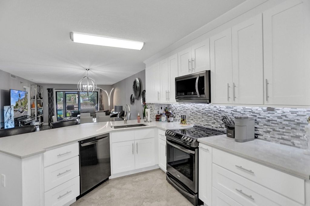 Photo of 2238 N Cypress Bend Drive #105, Pompano Beach, FL 33069 (MLS # F10459468)