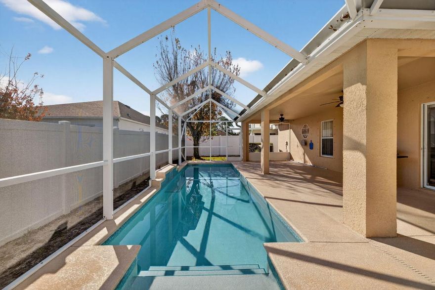 Welcome to 6141 NW Wild Cotton Way — a well-cared-for pool home in Torino's Winterlakes community.6141 NW Wild Cotton Way delivers space, upgrades, and a peaceful setting—located on the lake in Torino's Winterlakes community, with a fully fenced yard for privacy.

This 4-bedroom, 2-bath home offers a versatile layout with separate living spaces—a living room/dining room combo plus a separate family room, giving everyone room to spread out. The main living areas feature tile flooring, while the bedrooms have laminate flooring for a clean, modern feel. The eat-in kitchen is ideal for casual meals, and you'll love that all appliances are less than 3 years old. The primary bathroom has been meticulously renovated, featuring an updated, spacious shower and dual sinks for a fresh, spa-like experience. Step outside to your private backyard retreat with a solar-heated lap pool (approx. 6 ft deep) and relaxing lake viewsperfect for morning swims or sunset lounging.

Additional highlights include underground electric, and an HOA that makes life easier with lawn care includedall wrapped into a low-maintenance lifestyle in a great Port St. Lucie location.