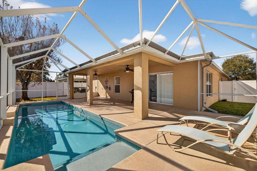 Welcome to 6141 NW Wild Cotton Way — a well-cared-for pool home in Torino's Winterlakes community.6141 NW Wild Cotton Way delivers space, upgrades, and a peaceful setting—located on the lake in Torino's Winterlakes community, with a fully fenced yard for privacy.

This 4-bedroom, 2-bath home offers a versatile layout with separate living spaces—a living room/dining room combo plus a separate family room, giving everyone room to spread out. The main living areas feature tile flooring, while the bedrooms have laminate flooring for a clean, modern feel. The eat-in kitchen is ideal for casual meals, and you'll love that all appliances are less than 3 years old. The primary bathroom has been meticulously renovated, featuring an updated, spacious shower and dual sinks for a fresh, spa-like experience. Step outside to your private backyard retreat with a solar-heated lap pool (max depth is approximately 6 ft deep).

Additional highlights include underground electric, and an HOA that makes life easier with lawn care includedall wrapped into a low-maintenance lifestyle in a great Port St. Lucie location.