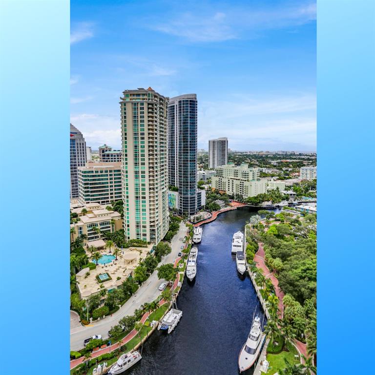 JUST LISTED! THE PERFECT HIGH FLOOR UNIT WITH BEAUTIFUL ON TREND DESIGNER FEATURES, WINDOW TREATMENTS AND CUSTOM DINING ROOM WALL CABINET WITH BEVERAGE REFRIGERATOR. AND THE ICING ON THE CAKE? ALL NEW BIG TICKET ITEMS- NEW A/C, NEW WASHER / DRYER AND NEW DISHWASHER MANY OTHER UPDATES- SEE ATTACHED LIST. ALL IMPACT GLASS WINDOWS. THE BEST 5 STAR AMENITY BUILDING IN THE CITY WITH ROOFTOP POOL, RIGHT ON THE RIVER. YOU CAN WALK TO LAS OLAS AND BE AT THE AIRPORT IN 15 MINUTES. COME HOME EVERY EVENING TO THE GORGEOUS NIGHT LIGHT CITY VIEWS. YOU WILL LOVE LIVING HERE! GREAT PARKING SPOT ACROSS FROM THE ELEVATOR.