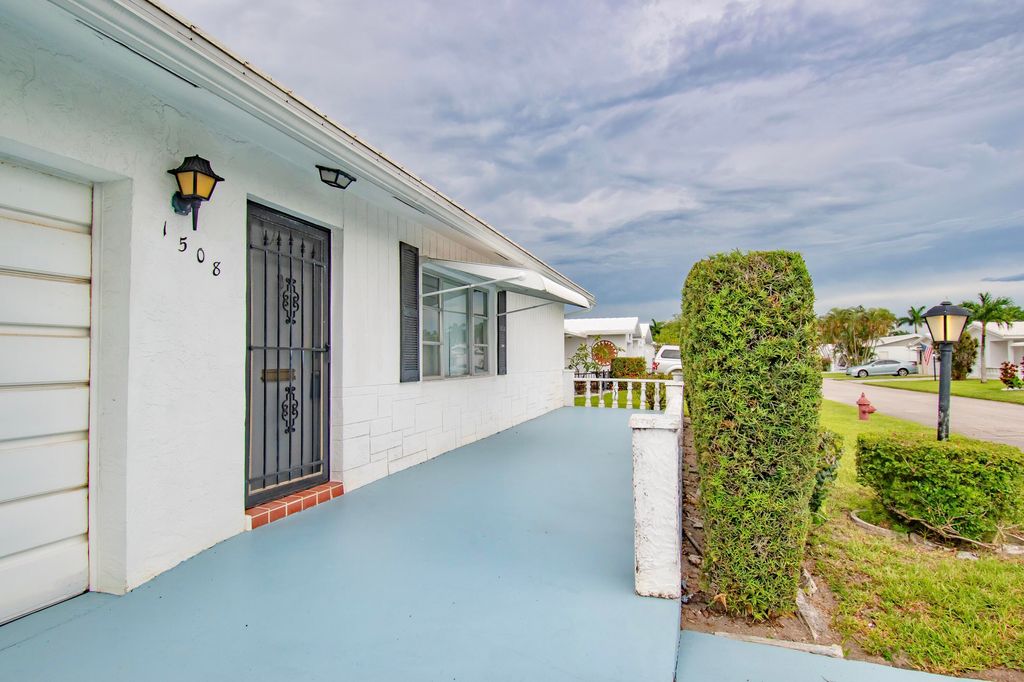 Photo of 1508 SW Nicholas Drive, Boynton Beach, FL 33426 (MLS # R11000436)