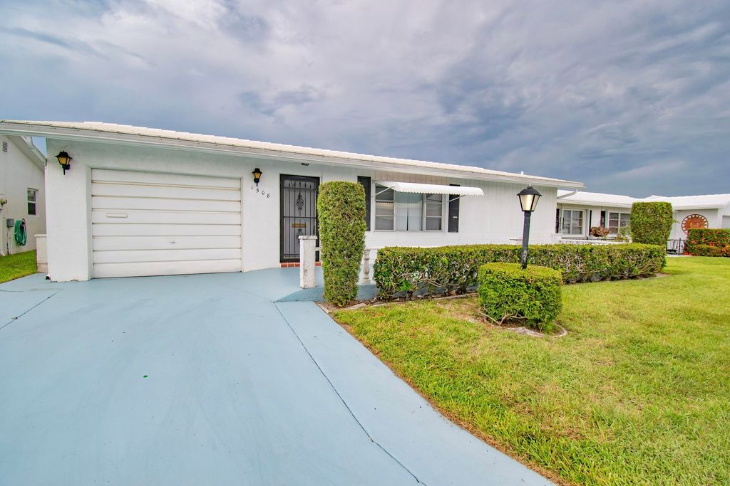 Photo of 1508 SW Nicholas Drive, Boynton Beach, FL 33426 (MLS # R11000436)