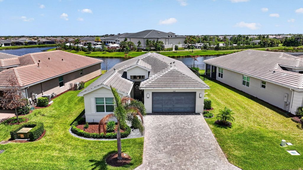 Photo of 11869 SW Poseidon Way, Port Saint Lucie, FL 34987 (MLS # B26018128)