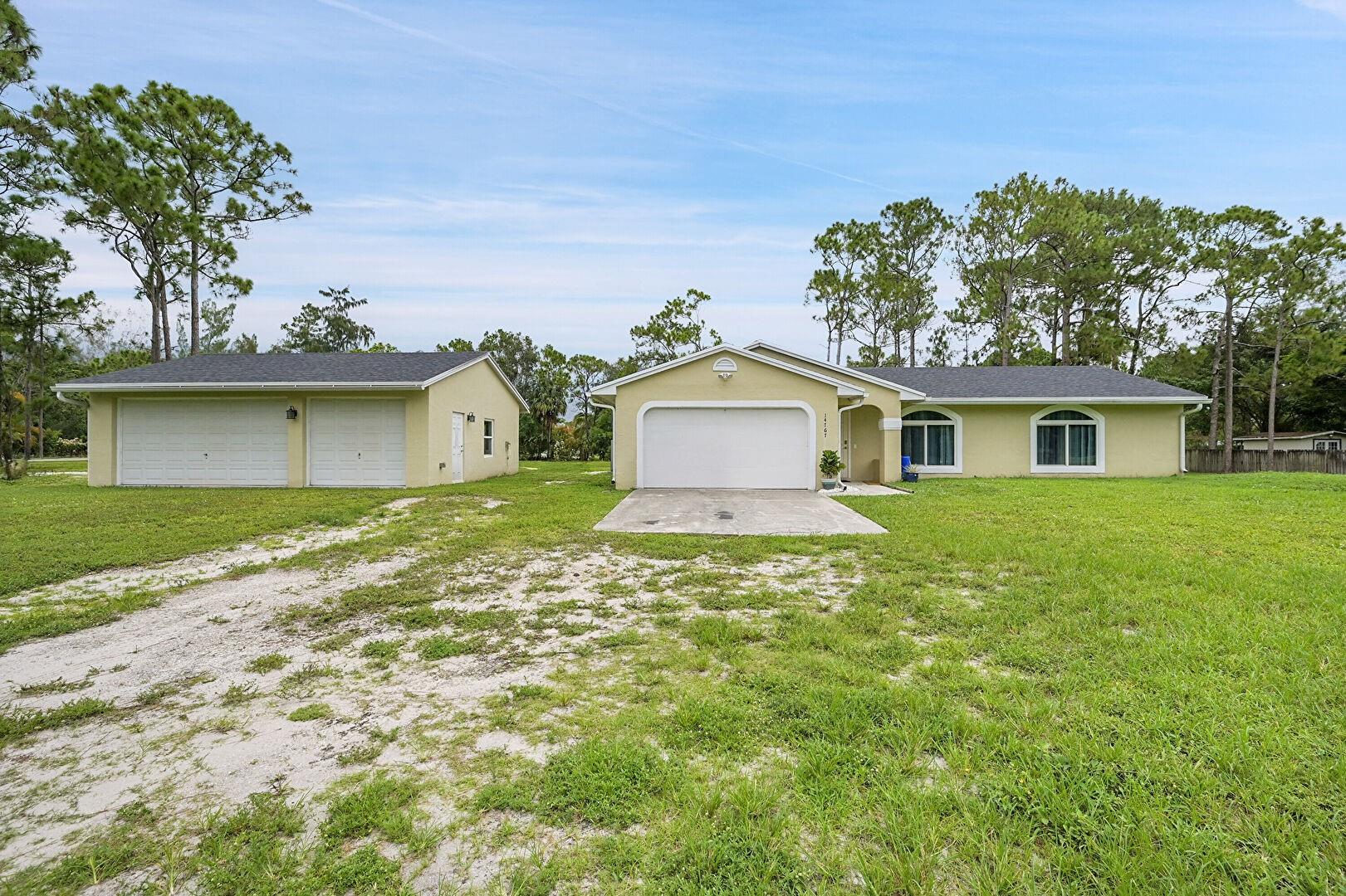 Turnkey Home in the Heart of Loxahatchee, Florida. Welcome to this beautifully upgraded 3-bedroom, 2-bath home offering 1,250 Sq ft under air, nestled on over an acre of fully fenced land with a private canal. This move-in-ready gem features a new roof (2022), double-pane impact windows and doors, luxury vinyl flooring, and updated bathrooms and kitchen with modern finishes. Enjoy peace of mind with new piping, a reverse osmosis water system, and a newer hot water heater (2022). In addition to the attached 2-car garage, this property boasts a bonus 3-car detached garage—perfect for a workshop, storage, or additional vehicles. A rare opportunity to own a completely upgraded home with space, privacy, and functionality in the desirable Loxahatchee area. No HOA.
***Showings will begin 7/14/25