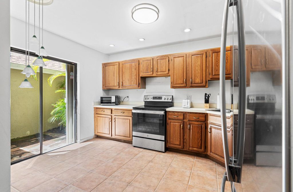 Photo of 704 Maplewood Drive, Greenacres, FL 33415 (MLS # R11135937)